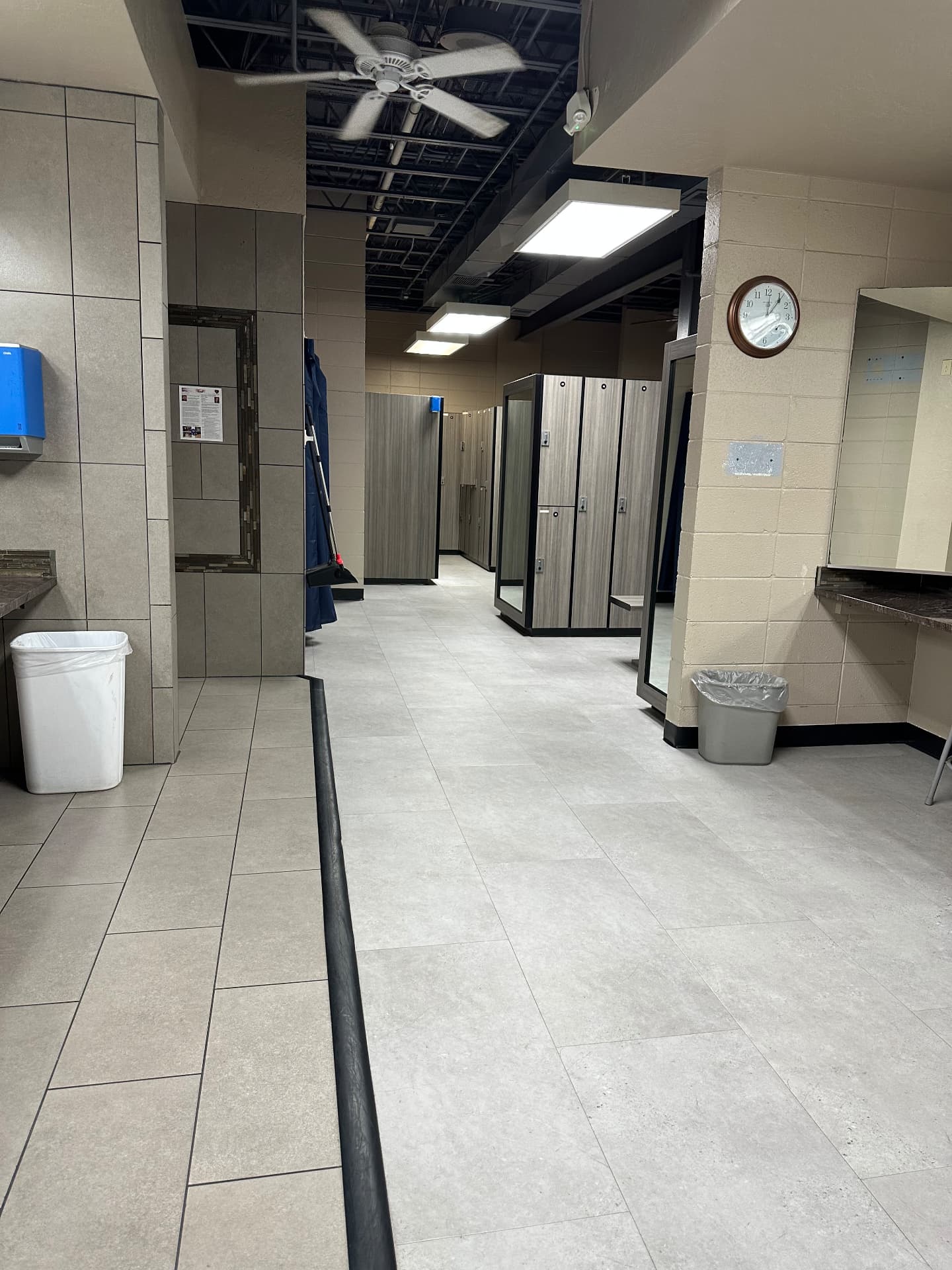 Showers and locker corridor Locker room and shower corridor cleaned and deodorized by a commercial gym cleaning crew