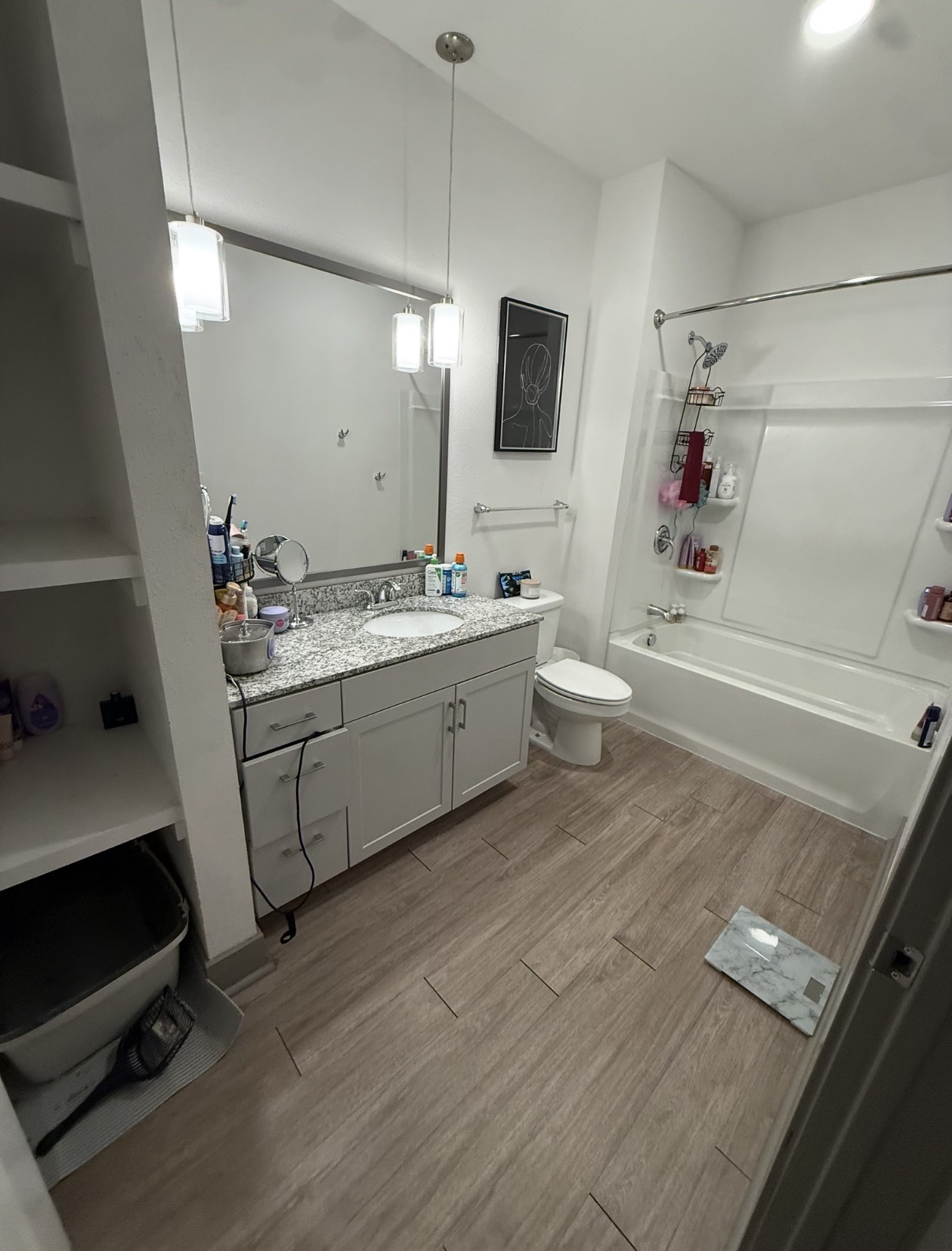 Same bathroom after dog waste cleanup with floors cleaned and sanitized and tub and vanity wiped down