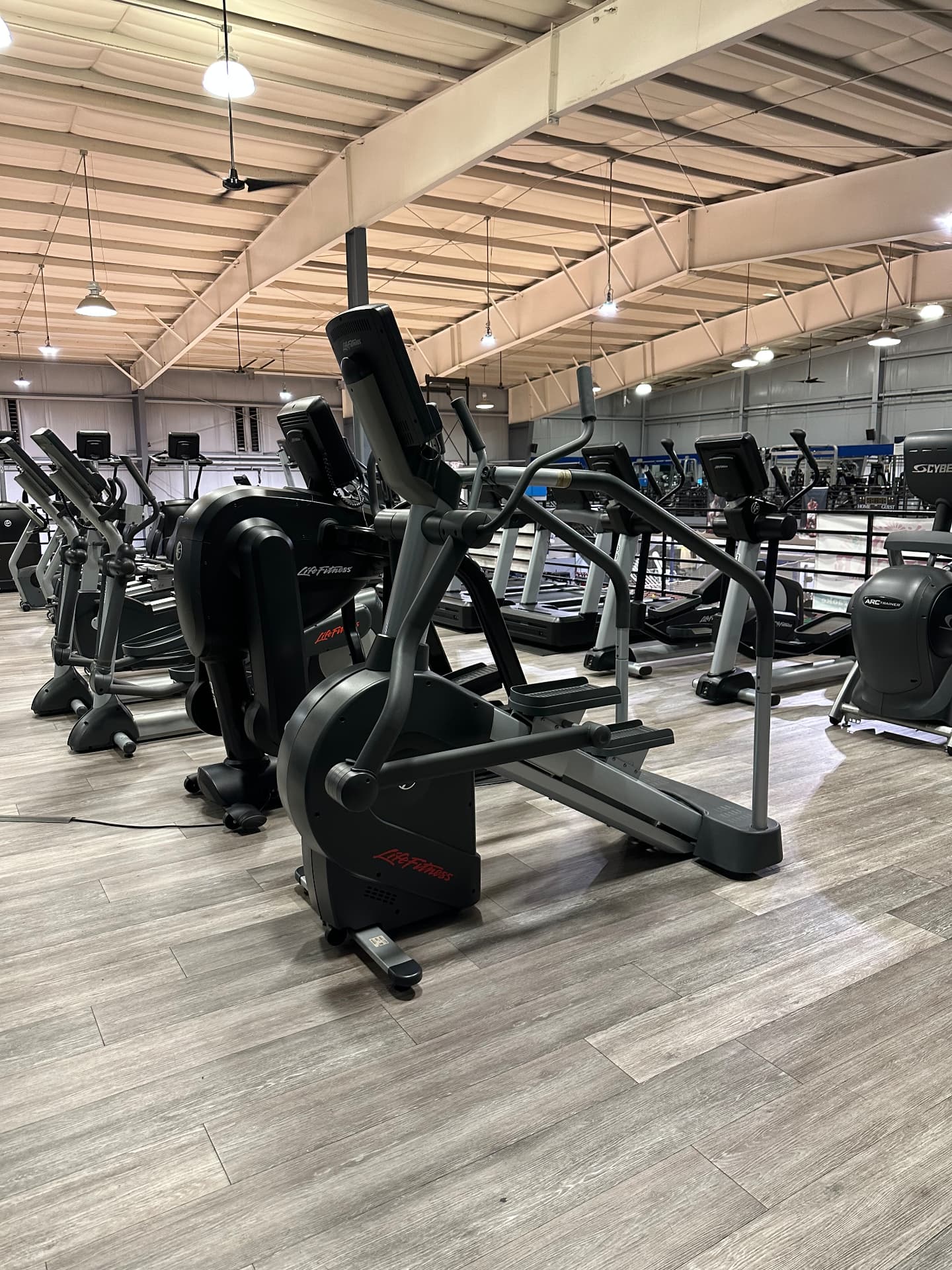 Equipment sanitization Rows of treadmills and ellipticals sanitized during overnight gym cleaning service