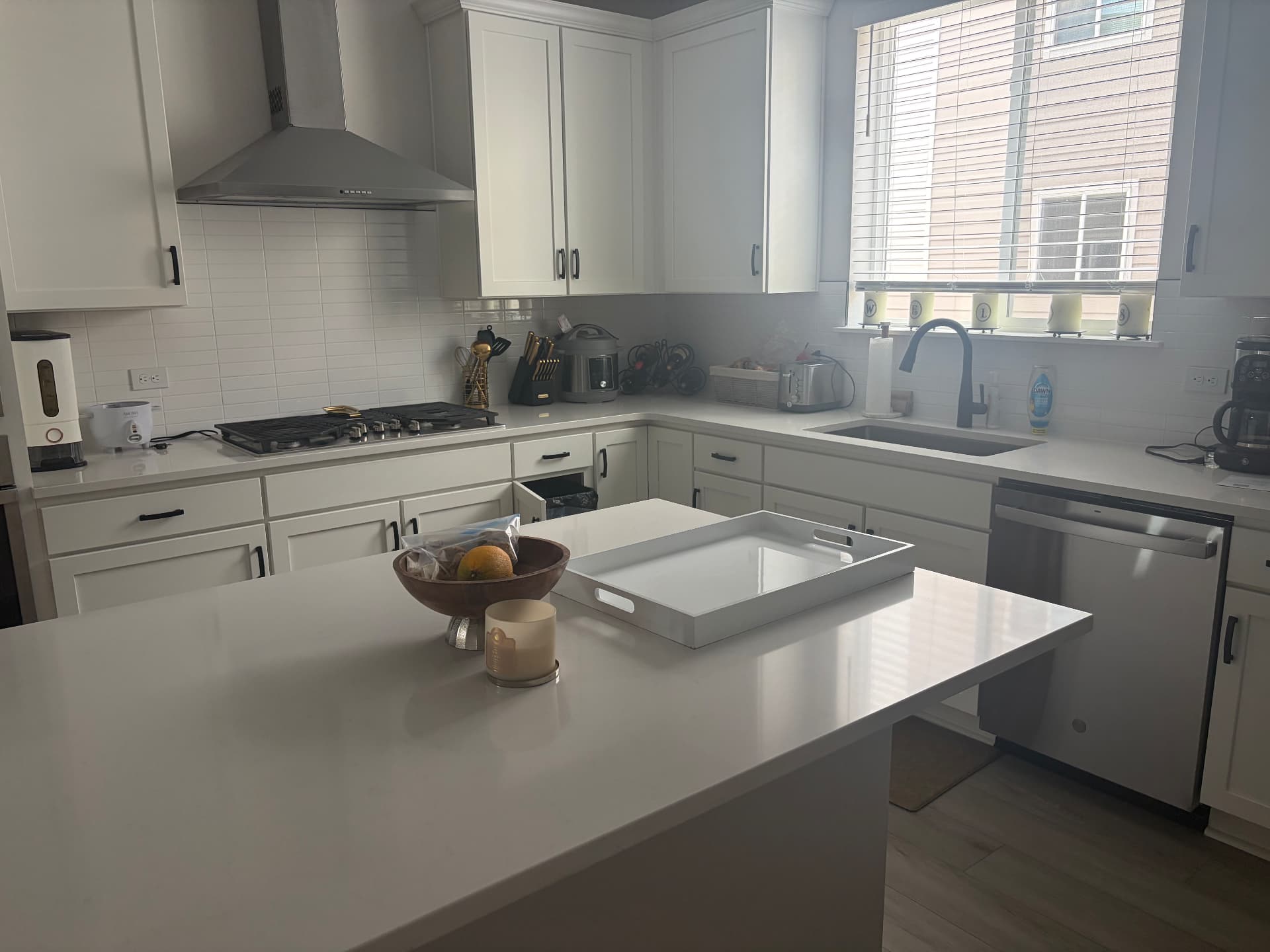 Deep clean kitchen, quartz counters Quartz kitchen island and countertops wiped down during a deep cleaning appointment in a Colorado home